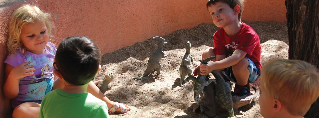 Sandbox Tucson - Kids Playing with Dinosaurs